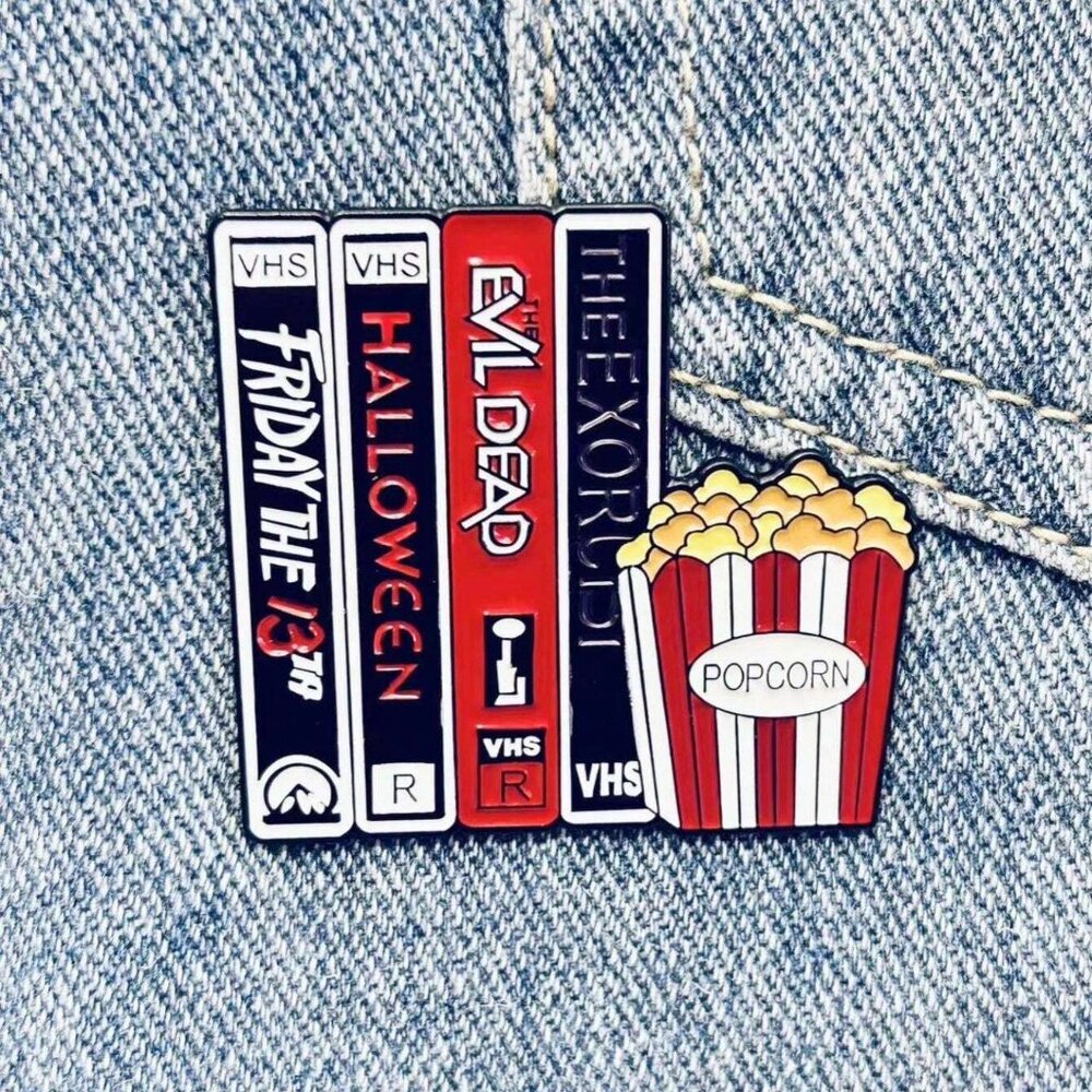 HORROR CLASSICS STACK OF VHS TAPES & POPCORN OIL DRIPPED ENAMEL PIN  BROOCH NWT